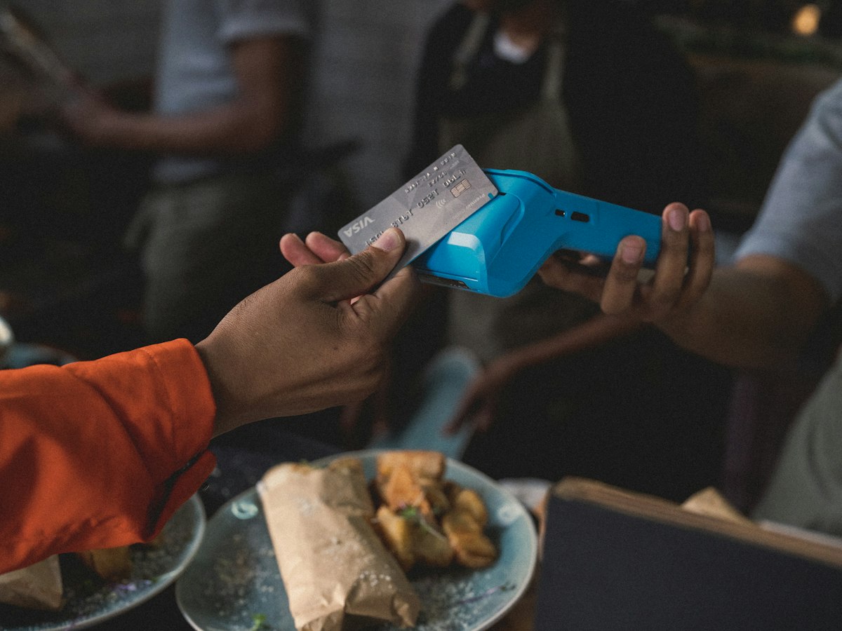 Card payment on a terminal at the table in a restaurant